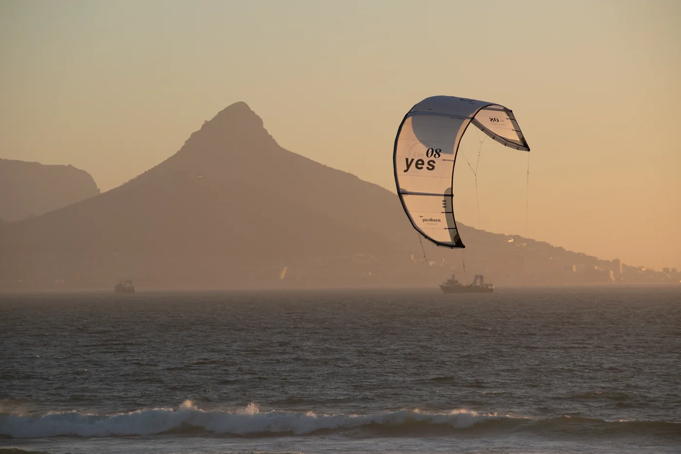 Kite flying off Blouberg with Lion's Head in the background