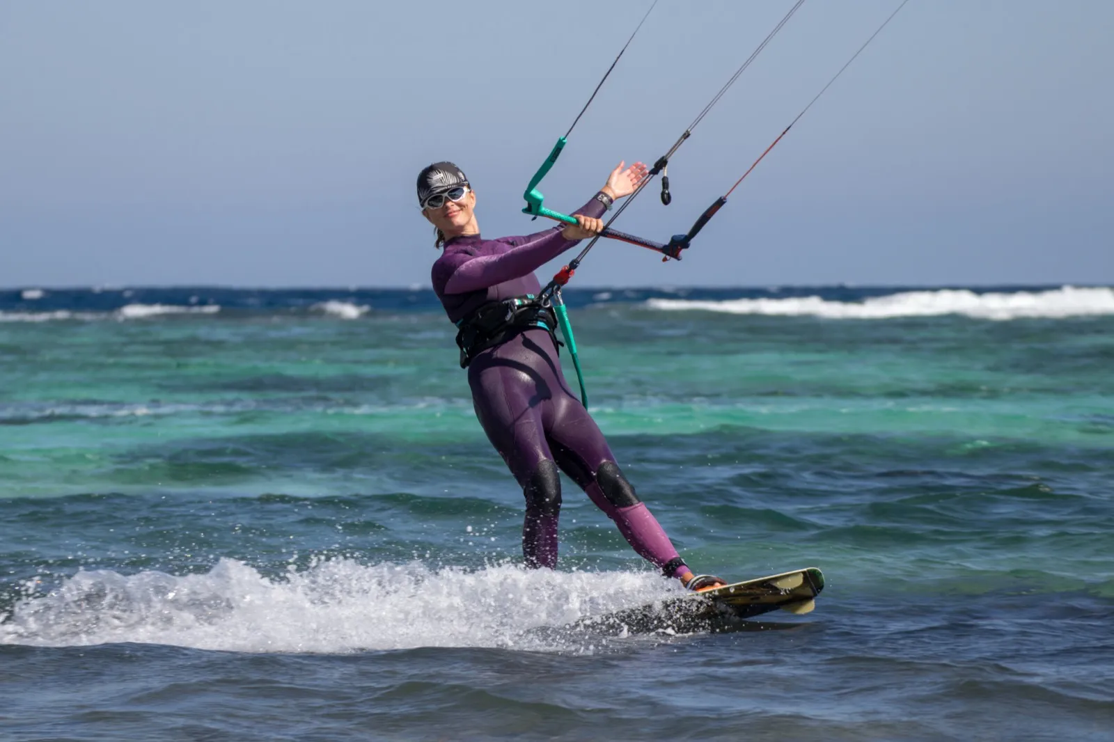 A kitesurfer smiling mid-session on Dahab Lagoon's flat water