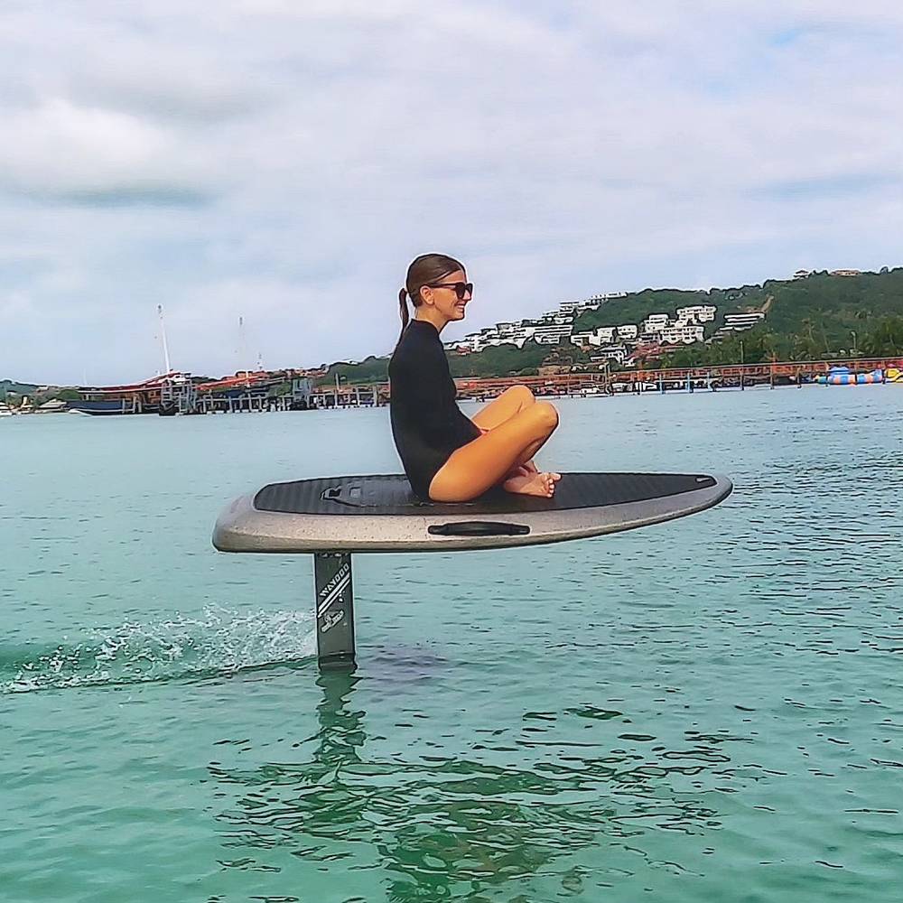 Guest flying on the e-foil while sitting