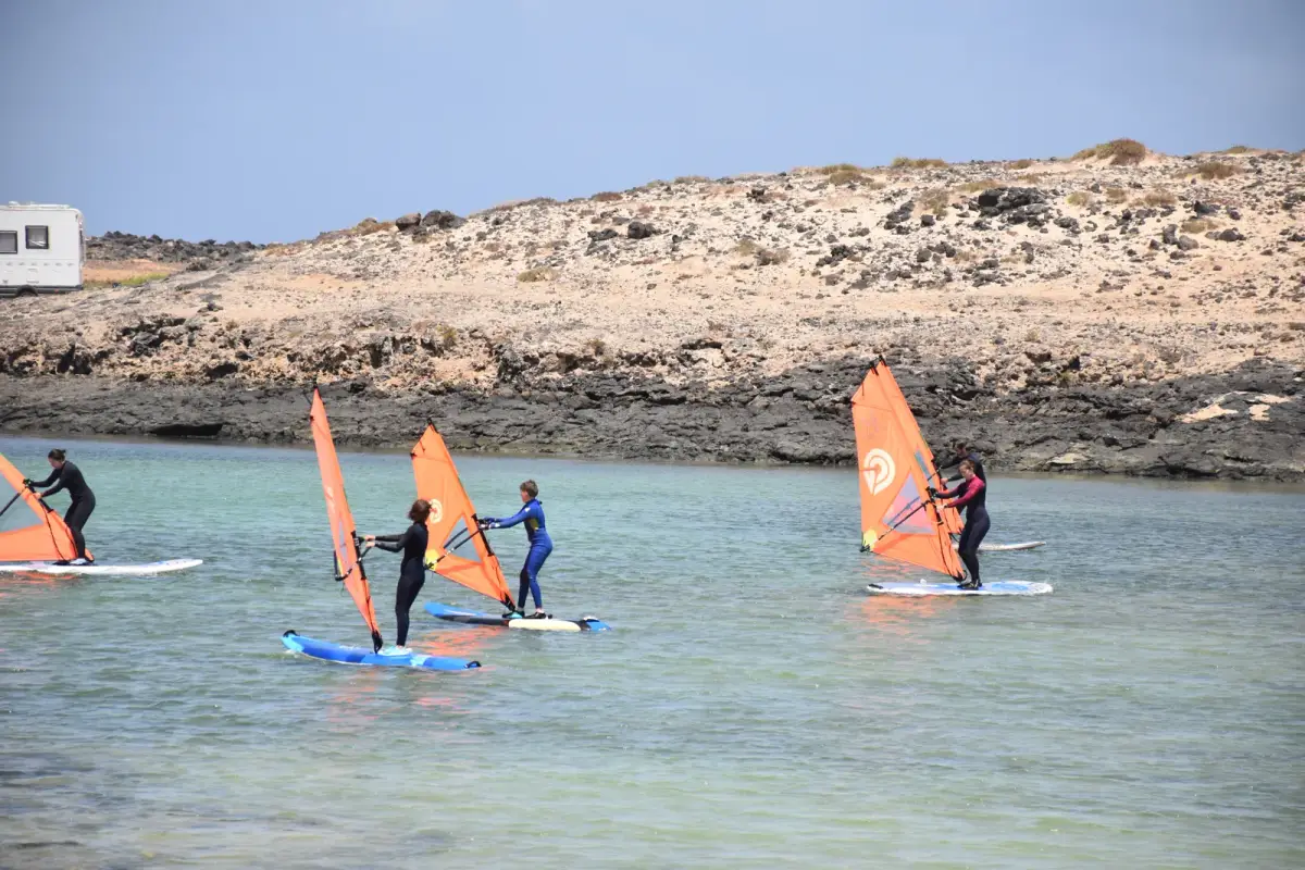 Gecko Windsurf School students learning on the flat, shallow lagoon at Playa del Río