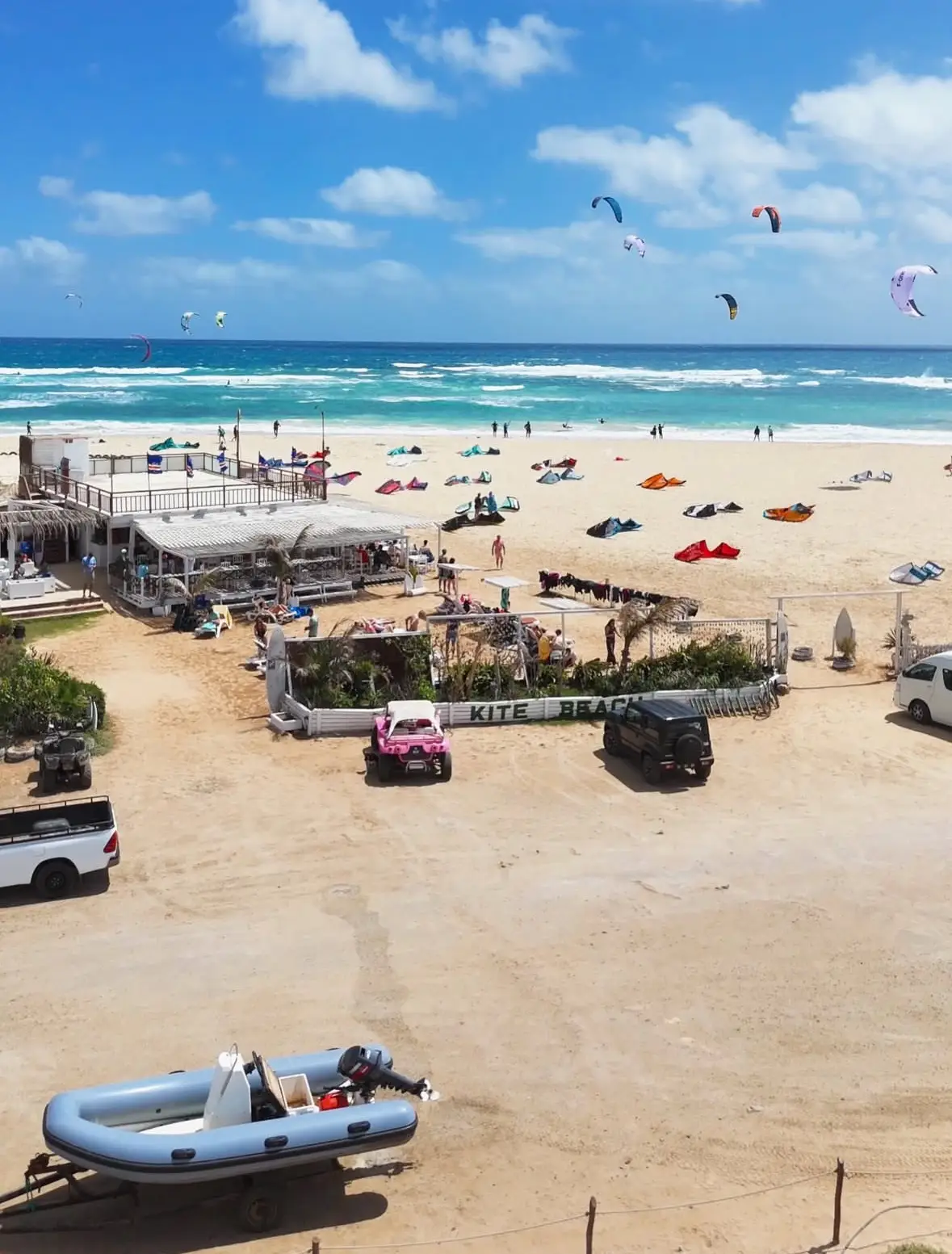The Kite Beach centre and the beach from above, with kites laid out on the sand