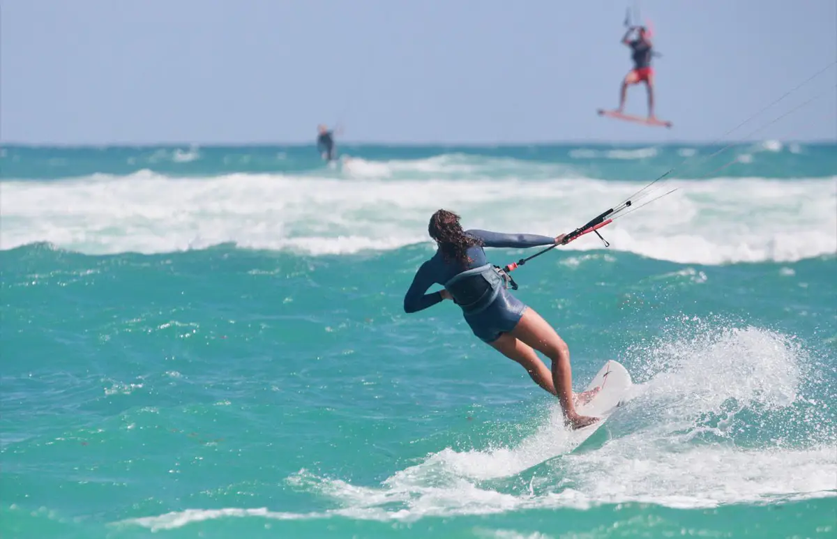 Kitesurfer carving through the waves off Kite Beach